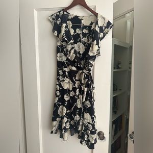 White flowered with black ruffled dress